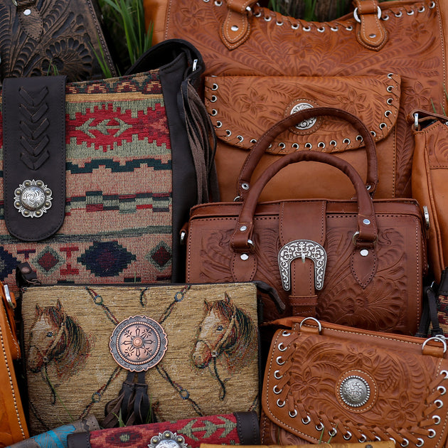 Rocky Hill fringe hair on hide purses. These are heading to Texas, but you  can get yours at gowestdesigns.us.