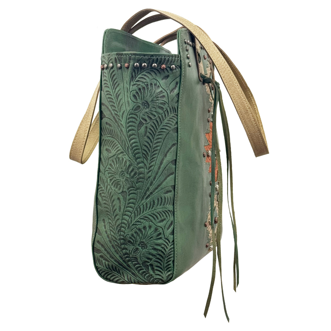 Side view of Navajo Soul tote in light turquoise with hand tooled leather accents