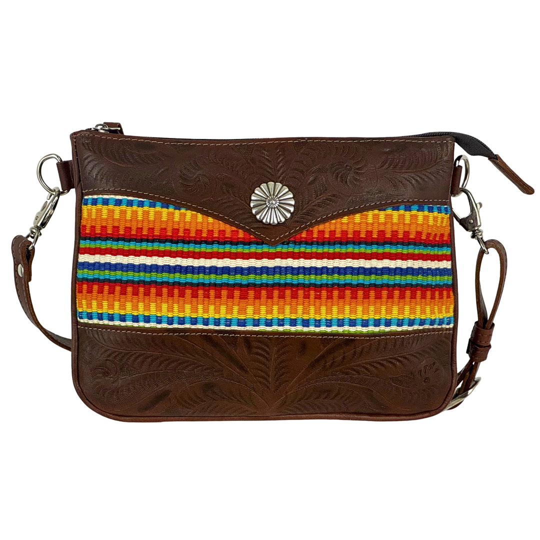 Maká Festive multi compartment crossbody in brown with hand tooled leather, red themed hand woven tapestry, and concho