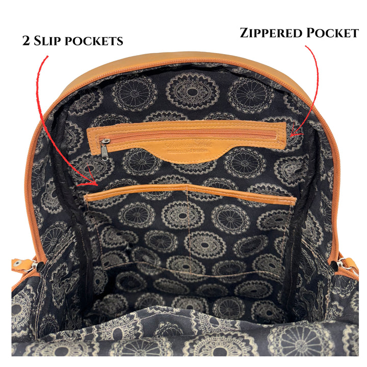 Inside view of Classic Travel backpack with hair-on hide in natural tan showing zippered and slip pockets