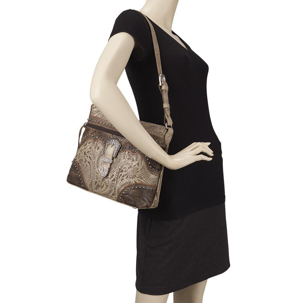 Saddle Ridge shoulder bag in sand with hand tooled leather accents and buckle on mannequin
